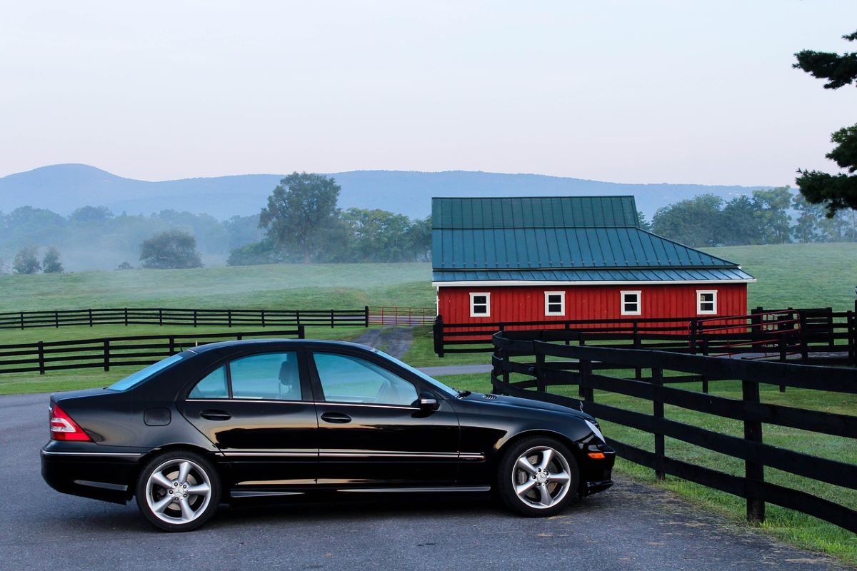 car outside a barn